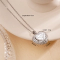 Silver heart necklace with pearl inlay and textured border on a ceramic stand - Heart (953)