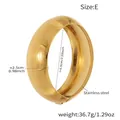 Detailed view of the 2.5cm wide gold-plated stainless steel hammered texture cuff bangle - Horizontal Fine Grain Style (Z499-E) / Gold