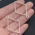 Pair of silver-finished diamond-shaped hollow geometric charms for DIY jewelry making - Rhombus Bezel (22259) / 39x25mm / Bright Silver