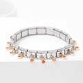 Silver modular link bracelet with gold charms and orange-red gemstones on white decor - Champagne