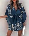 Detail of V-neck ruffled sleeve dress with navy leaf print and drawstring waist tie - S / Navy Blue