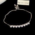 Detail of adjustable silver chain bracelet with 8 pearls and shimmering zircon accents - Bracelet - Silver