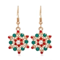 Detailed view of Christmas snowflake earrings with red green rhinestones and a white pearl - Dinosaur Silhouette