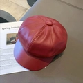 Detailed close-up of dark red PU leather beret with fine texture on a fashion magazine - One Size / Burgundy
