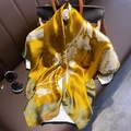 Elegant yellow silk scarf with white floral patterns styled on a luxury handbag - 23212 Main Image / 90*90cm