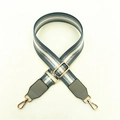 Detail of adjustable blue and silver glitter wide shoulder strap with gold metal buckles - Light Blue + Gray Leather