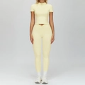Women's light yellow two-piece yoga set with V-waist leggings and half-zip short sleeve top - M / Top And Bottom / Creamy Yellow