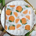 Square orange print dinner napkin on a white lace plate with elegant gold cutlery - Orange & Blossom (1106)