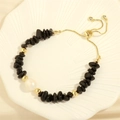 Detail of adjustable gold slider clasp with black stone chips and freshwater pearl - Black Agate