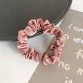 Pinkish brown silk satin scrunchie placed on a black tray with a decorative card - Orange Red Solid