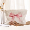 Cream corduroy makeup bag featuring a large pink bow print and a secure zipper closure - Beige Pink Big Bow (MZ042121)
