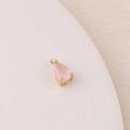 Macro shot of a pink teardrop zircon charm with gold-plated setting for DIY jewelry making - Rose Red (9#)