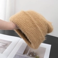 Close-up of warm camel fluffy knit hat showing soft fuzzy texture and thick warm material - Stretchy / Khaki