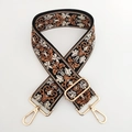 Dettaglio della tracolla per borsa in jacquard bohémien con ganci rotanti dorati - Base Nera Marrone / Fibbia Oro