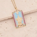 Macro view of Justice tarot pendant with blue enamel and colorful gemstones - Justice
