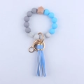 Llavero de pulsera con cuentas de silicona, borla de cuero azul y cierre dorado - Azul