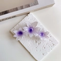Detail of purple gradient flower hair claw clip with acetate petals on a stone board - Fresh Purple