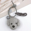 Detail of grey plush teddy dog keychain with spiral strap, bell and plastic chain links - With Bell / Gray