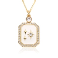 Macro detail of gold plated crescent moon pendant with white enamel and sparkling zircons - White Starburst Rectangular Plate Style (E235)