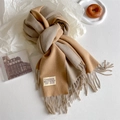 Detail of camel and beige double-sided cashmere scarf with soft fringes and brand label - Camel Grey