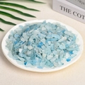 Polished natural aquamarine crystal stone chips in a white dish for aromatherapy - Aquamarine (7-9mm) 100g