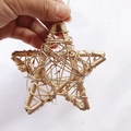 Close-up of handmade gold woven rattan star ornament with rustic natural wood texture - Pentagram / 10cm / Gold