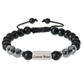 Macro detail of custom name engraving on a black matte beaded stainless steel bracelet - 1 Name Engraved / Magnetic Stone Bracelet