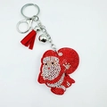 Detail of Christmas Santa keychain with red rhinestones, suede tassel, and metal bell - Santa with Christmas Tree