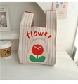 Close-up of beige knit tote bag with purple stripes and red tulip flower pattern - Flower Red