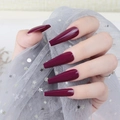 Close-up of deep burgundy long coffin press-on nails with a glossy UV finish - Burgundy (CBLL-18)