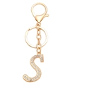 Detailed macro view of gold letter S keychain with sparkling rhinestone inlay - Letter S