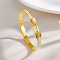 Detailed close-up of 18K gold-plated bangle featuring white mother of pearl and small zircons - Double T Mother of Pearl Bangle (Gold)