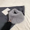 Furry grey winter handbag with plush faux fur texture and matching soft handle - Gray