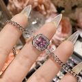 Close-up of sparkling pink square gemstone bracelet with micro-paved diamonds on hand - Pink Zirconia Square Flat Chain Style (0037)