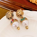 Close-up of vintage golden lion head earrings with large white pearl and colored rhinestones - Gold-Multicolor