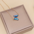 Minimalist gold necklace with blue crystal butterfly pendant on jewelry display box - 6# Necklace Dark Blue