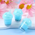 Three blue mini bubble tea charms with liquid and black pearls for DIY crafts - Blue
