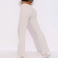 Detailed view of high-waist yoga pants with scrunch butt lifting and flared leg design - S / Off White