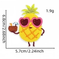 Close-up of pineapple embroidery patch with heart sunglasses and dimension markings - Pineapple