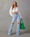 Détails du jean évasé taille haute bleu clair avec genoux déchirés et ourlets - S / Bleu clair
