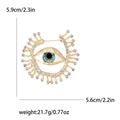 Fashionable gold alloy evil eye brooch with sparkling white rhinestones and blue pupils - Gold (MM-BR-GOLD3781-GD)