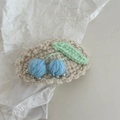 Close-up of handmade crochet hair clip featuring blue cherries and green leaf details - Crochet-Single Blue Cherry