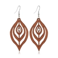 Detail of brown leaf-shaped hollowed wood earrings with silver hooks on white background - Style 7