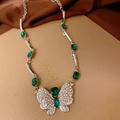 Detailed view of silver butterfly necklace with green gems and rhinestones on leather - 9# Necklace-Green Rhinestone Butterfly