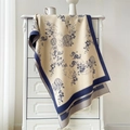 Detail of cashmere-like scarf with traditional blue floral and bird patterns on beige - 190x65cm / Beige Blue