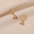 Elegant gold cherry earrings featuring red rhinestones and green gems on silk fabric - Cherry Style