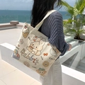 Off-white canvas tote bag with cute cartoon rabbit print and shoulder strap design - Eating Rabbit
