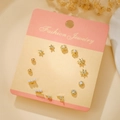 Set of 7 pairs gold titanium steel stud earrings featuring stars and pearls - Gold Star Arrow (E1924-1)