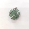 Green heart gemstone pendant with intricate metal wire wrapping on white background - Green Aventurine