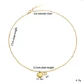 Golden titanium heart and bow pendant necklace showing precise length measurements - Gold Quote Heart